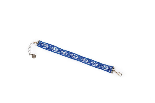 Bracciale in merletto blu metallizzato con cristalli