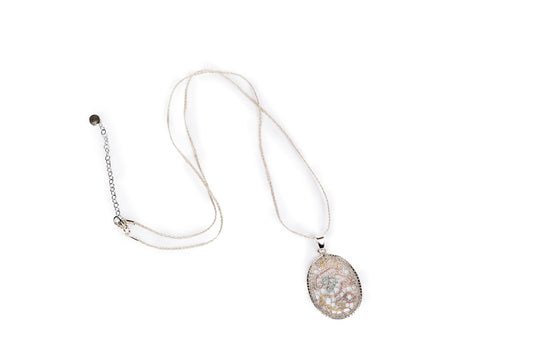 Ciondolo in merletto colore argento metallizzato